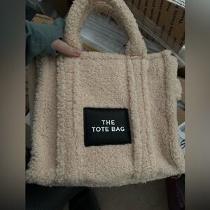 Sherpa tote bag. Top handle with black adjustable strap